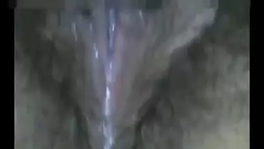 Desi female closes curtains to masturbates XXX hairy slit in sex video