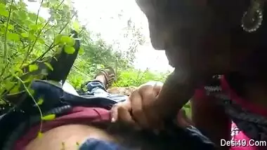 Guy simply lies on back but sex partner gives him a blowjob outdoors