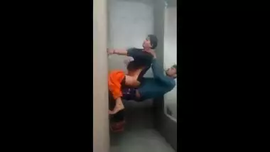 It looks like an amateur Indian couple is having sex on the wall