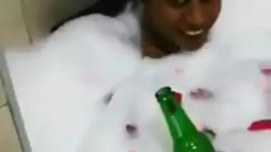 Attractive Desi chick enjoys beer and bubble bath in hot XXX video