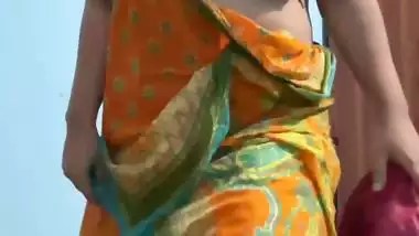 Curvaceous Indian girl removing saree and nude show