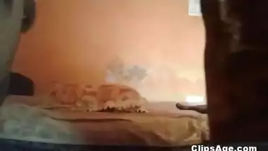 Indian guy making his wife lie back as he makes the video of himself fucking her
