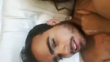 Bearded guy from India and girlfriend start morning with kissing